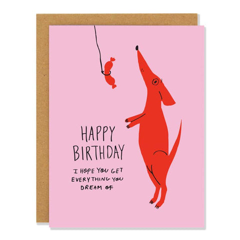 Birthday card with a red dog illustration and pink background, Happy Birthday I hope you get everything you dream of!