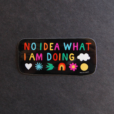 Colorful sticker with text 'NO IDEA WHAT I AM DOING' on a black background