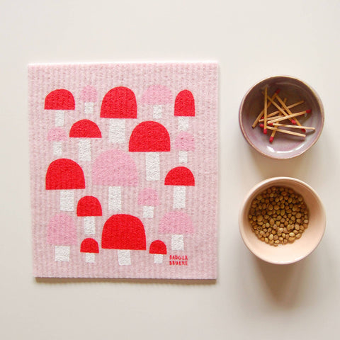 Pink and red patterned swedish cloth with mushrooms
